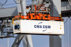 Refrigerated shipping container on crane