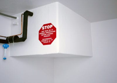 Inside of a polar leasing cooler rental with large stop sign